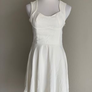 White sleeveless skater dress